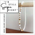 Load image into Gallery viewer, Beaded bracelet with gold and white beads on a wooden stick, with text 'I'd Still Swipe Right' on a white background.