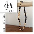 Load image into Gallery viewer, Beaded bracelet with gold and black beads on a wooden stand, with text 'I Still Do' and 'More colors available'.