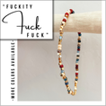Load image into Gallery viewer, Multicolored beaded bracelet on a wooden stick with text overlay on a light gray background