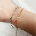 Load image into Gallery viewer, Two chain bracelets on a wrist against a white background